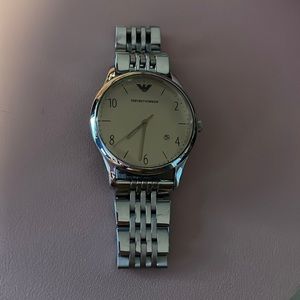Armani watch . Silver with tan interior inside the watch